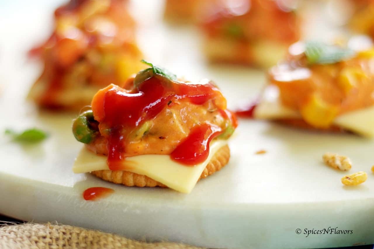 cheesy monaco bites monaco biscuit party topping starter recipe easy party starter recipe indian festival recipe party food potluck idea simple bachelor food