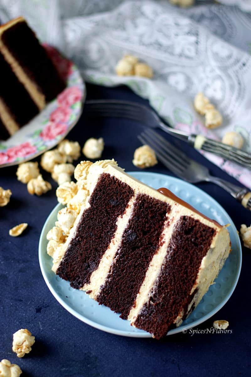 close up image of sliced eggless chocolate caramel cake showing triple layers of chocolate cake with creamy caramel frosting
