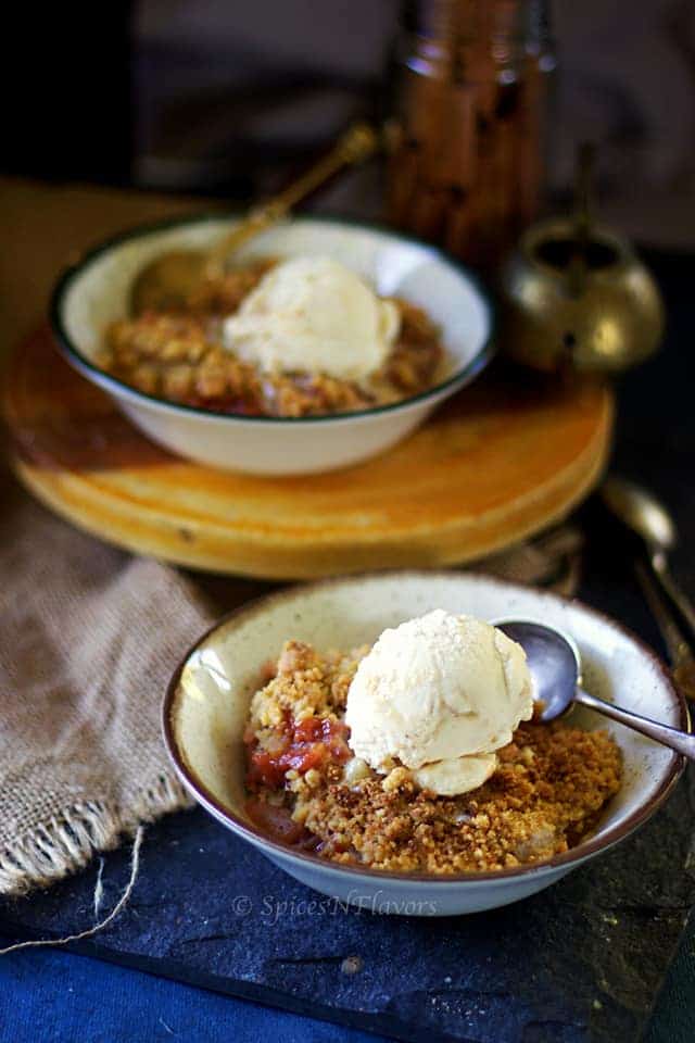 easy apple crisp served in a bowl with icecream