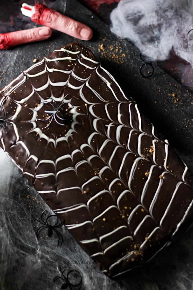 dark and moody image of halloween spider web cake design