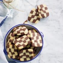 eggless checkerboard cookies in a pressure cooker and also in an oven. easy to follow step by step recipe with video butter biscuit vanilla cookies chocolate cookies