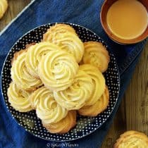 3 ingredient piped cookies piped biscuits butter biscuits butter cookies photography food photography how to make bakery style butter biscuits at home how to make bakery biscuits at home #butterbiscuits #pinterest #bakerybiscuits #3ingredientrecipes #cookies #biscuits #photography