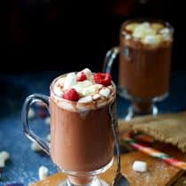 vertical image of raspberry hot chocolate drink
