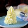 Best Buttercream Frosting piped on a plate to show the smooth and soft texture
