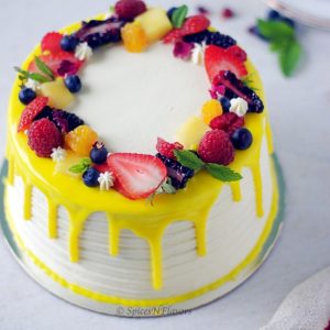 image of Fresh Fruit Cake showing the texture pattern on sides and topped with fresh fruits