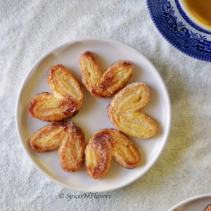 french Palmiers arranged like flowers on a white plate