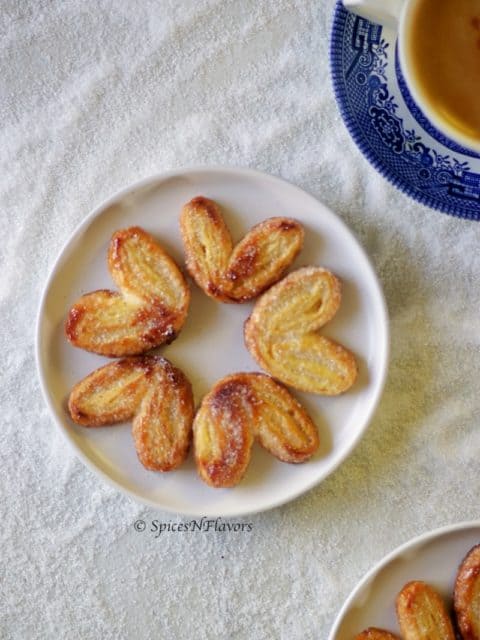 french Palmiers arranged like flowers on a white plate