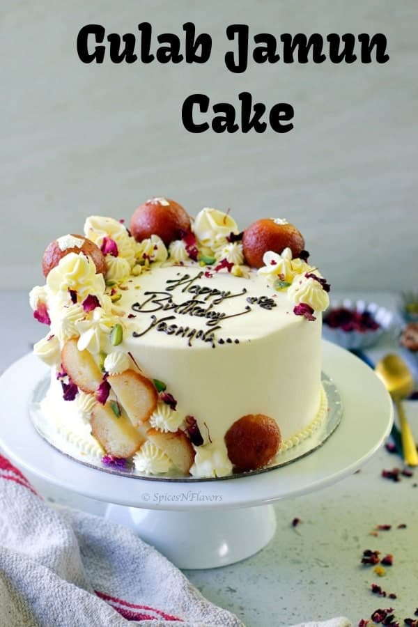 gulab jamun cake placed on a white cake stand