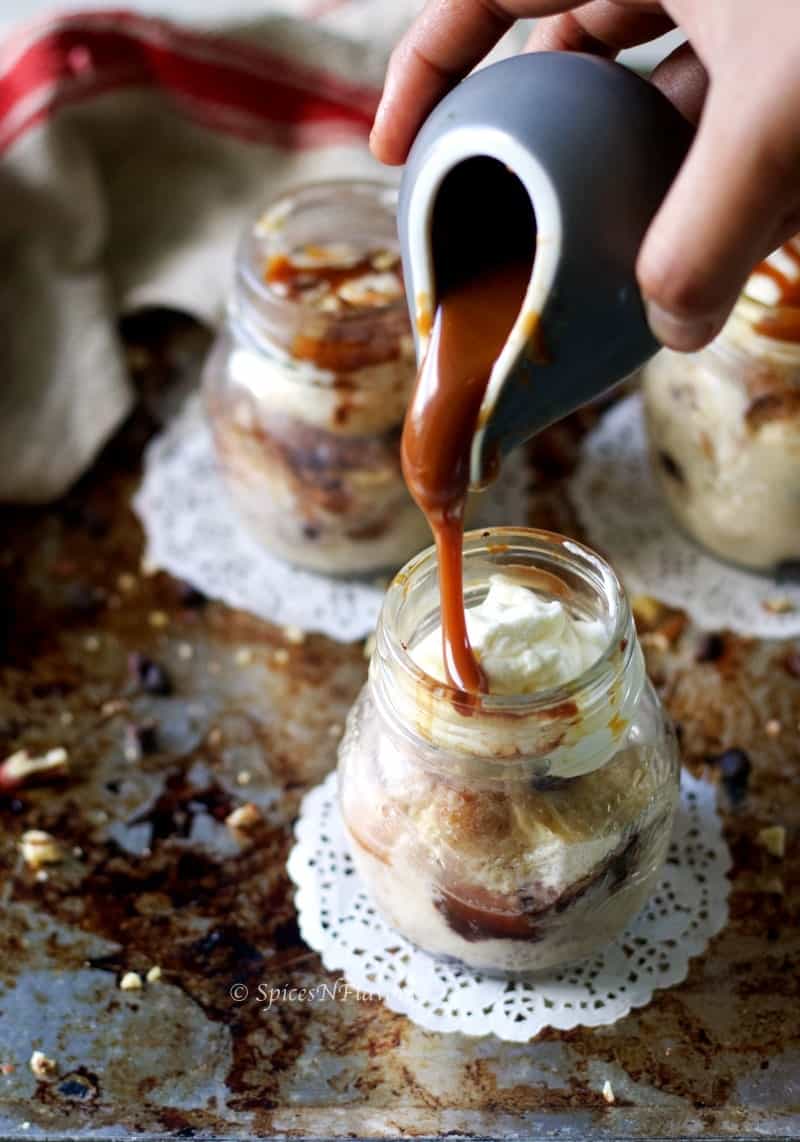 an image showing caramel sauce being poured on instant pot bread pudding jars