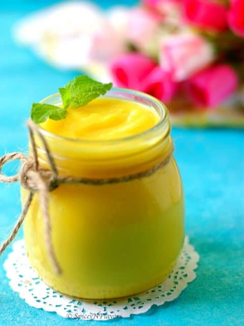 close up image of instant pot lemon curd with mint leaf garnish