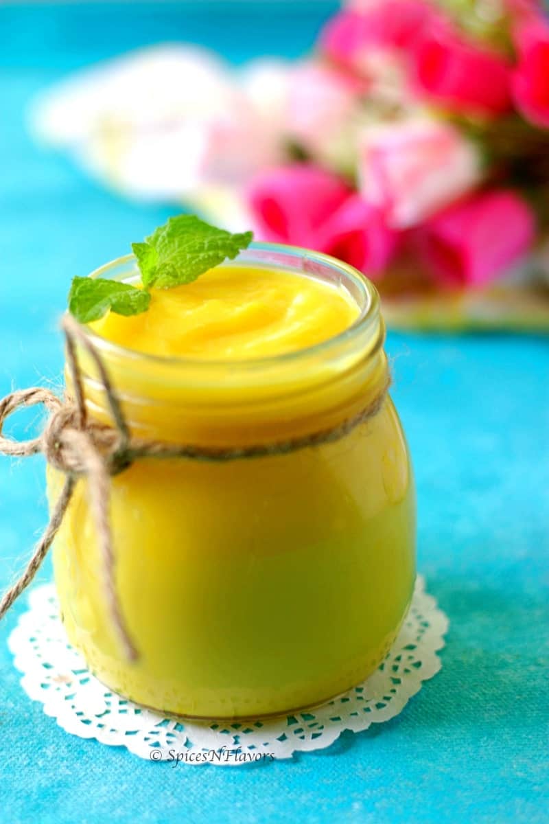 close up image of instant pot lemon curd with mint leaf garnish