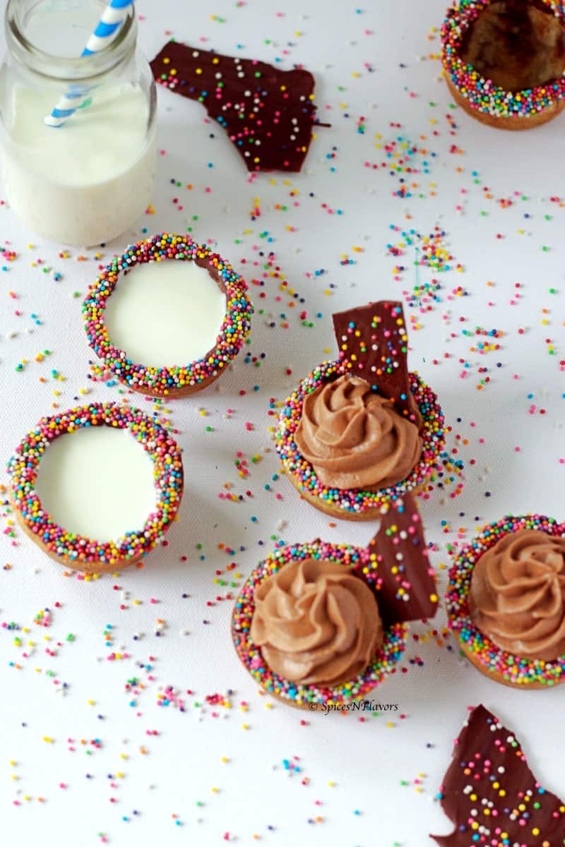 Eggless Chocolate Chip Cookie Cups filled with milk and frosting