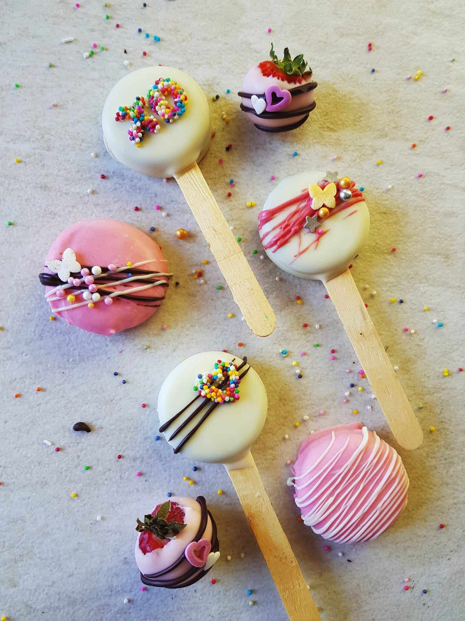 oreo biscuit popsicles dipped in melted chocolate and decorated as per valentines day theme