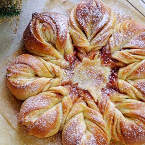 close up image of star bread with dusting of icing sugar