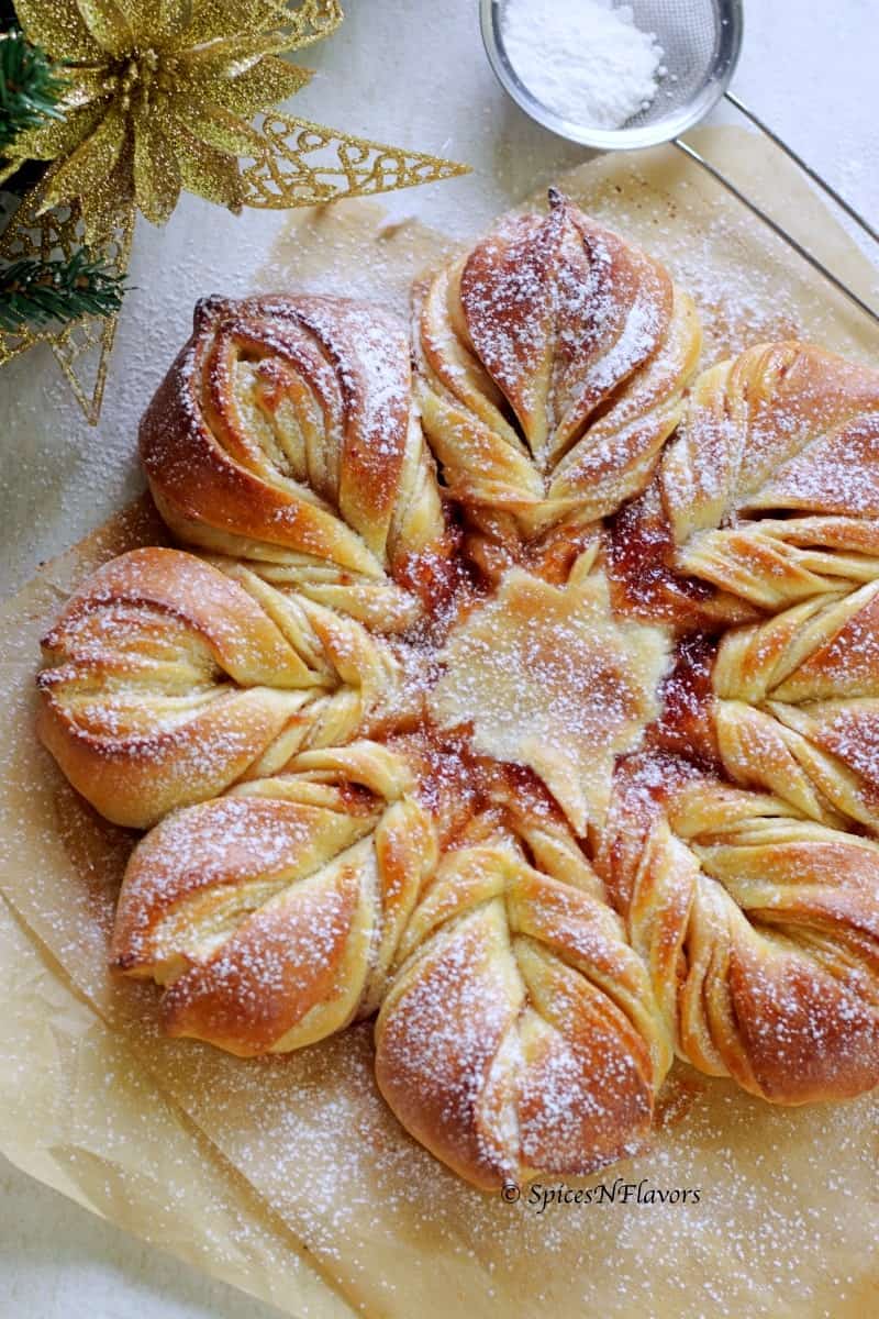close up image of star bread with dusting of icing sugar