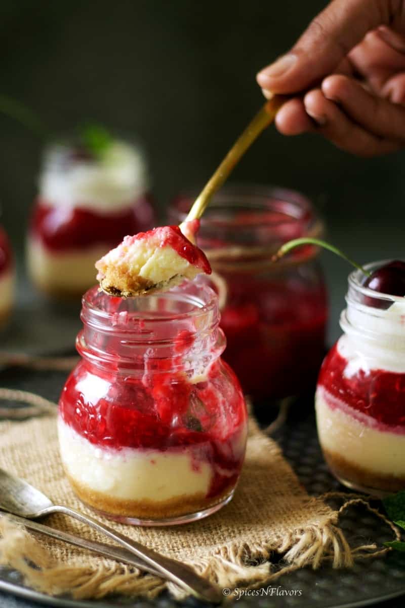 instant pot cheesecake scooped out in a spoon to show the texture