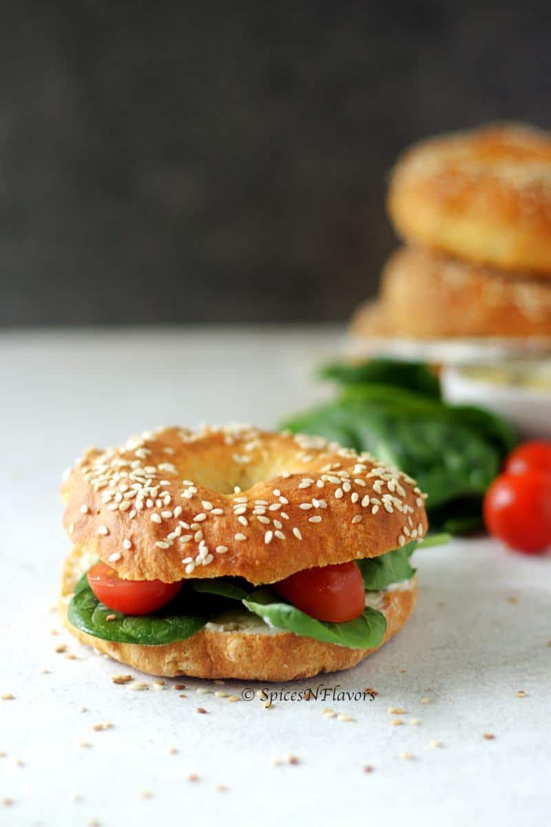 bagel sandwich : bagels filled with cream cheese, spinach and tomatoes