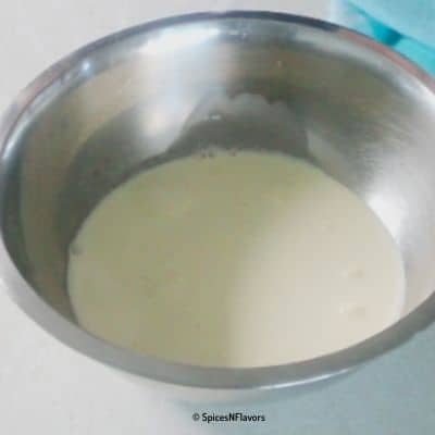 whipping cream placed in a stainless steel bowl