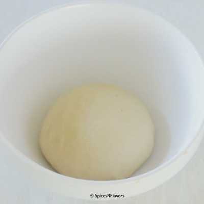 kneaded dough placed in a bowl