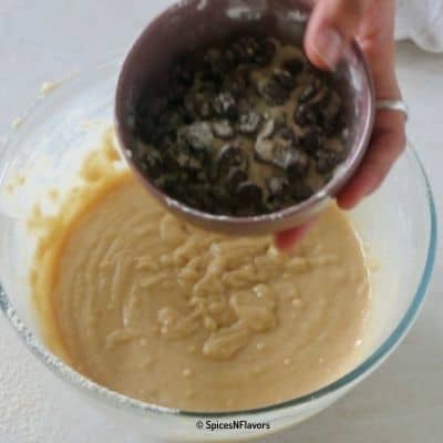 adding chocolate chips to the cake batter