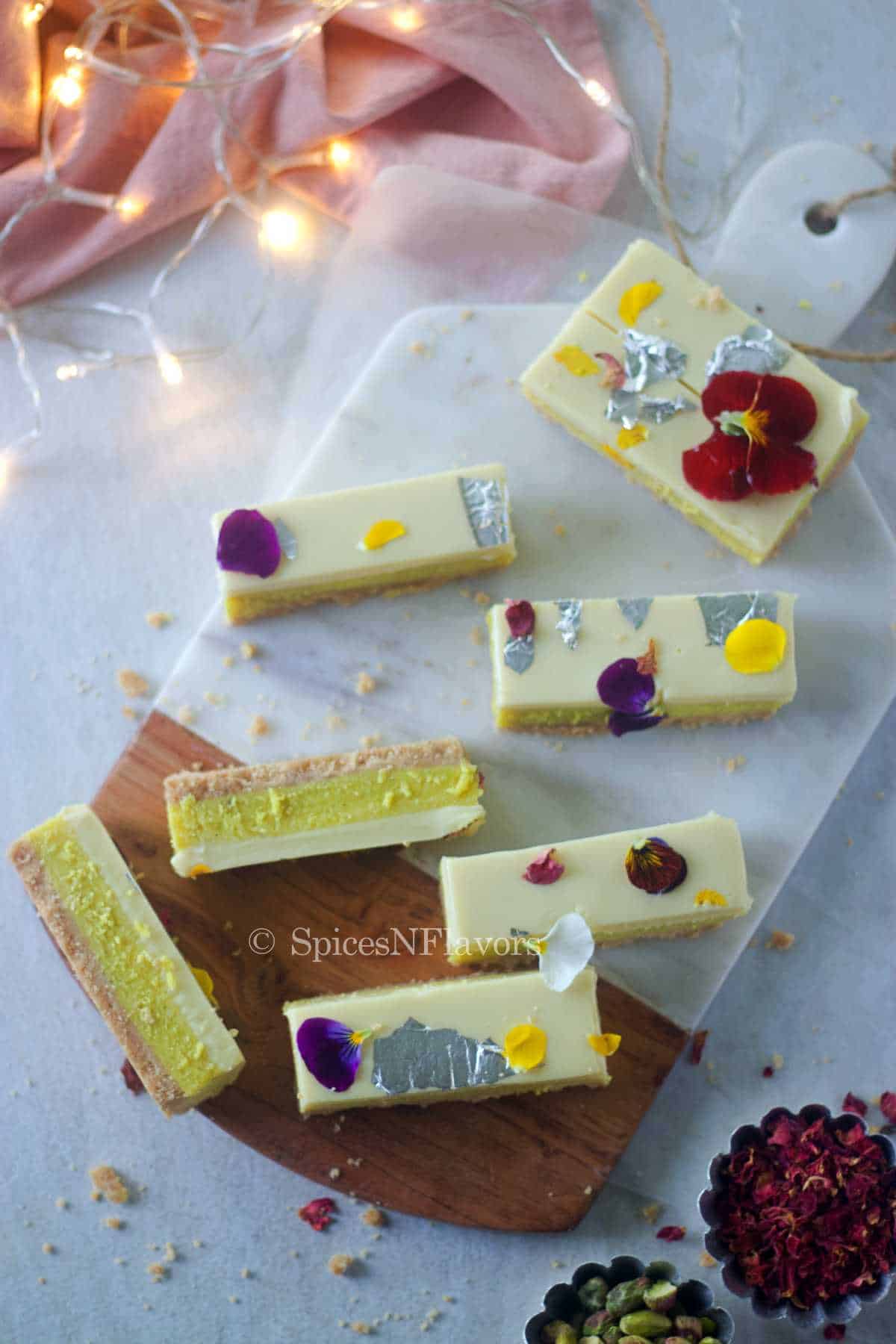 burfi bars placed on a marble serving board
