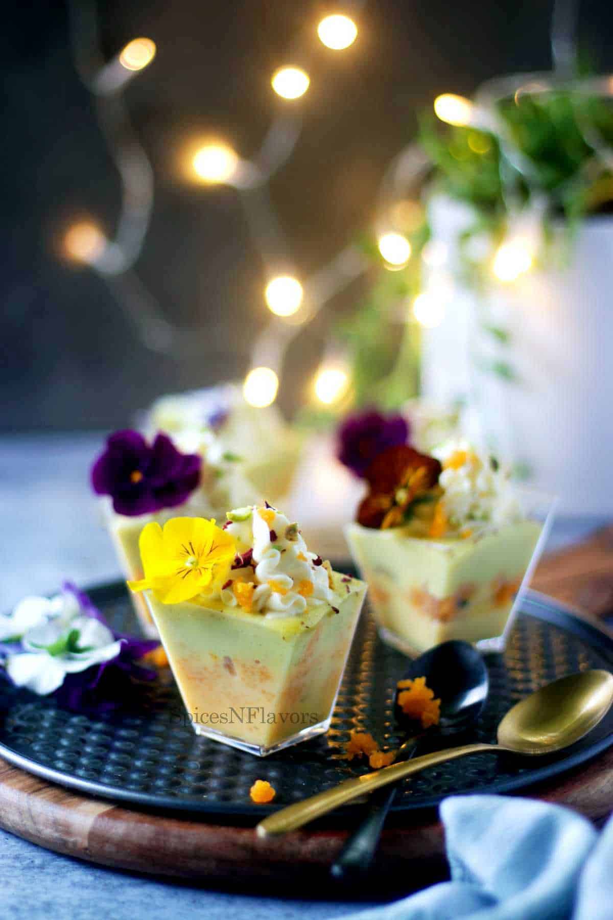 rasmalai trifle shot glasses decorated with edible flowers