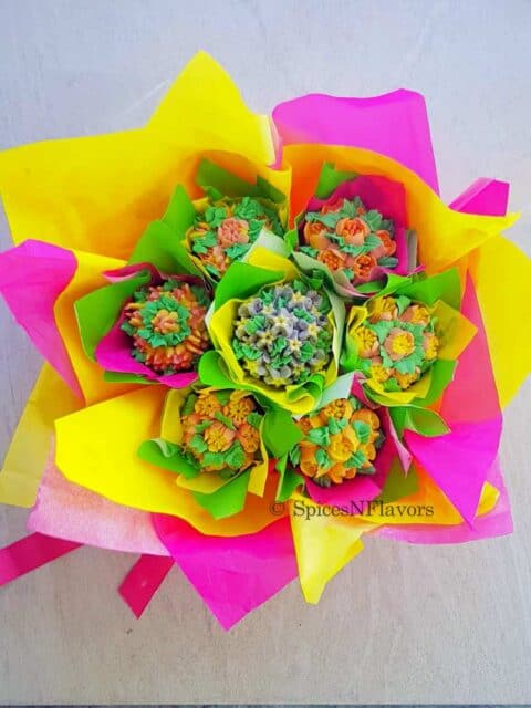 cupcakes arranged in a bouquet placed on a white background