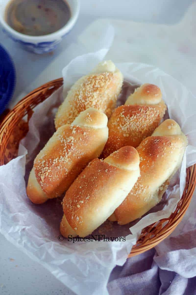 spanish bread rolls placed on a basket