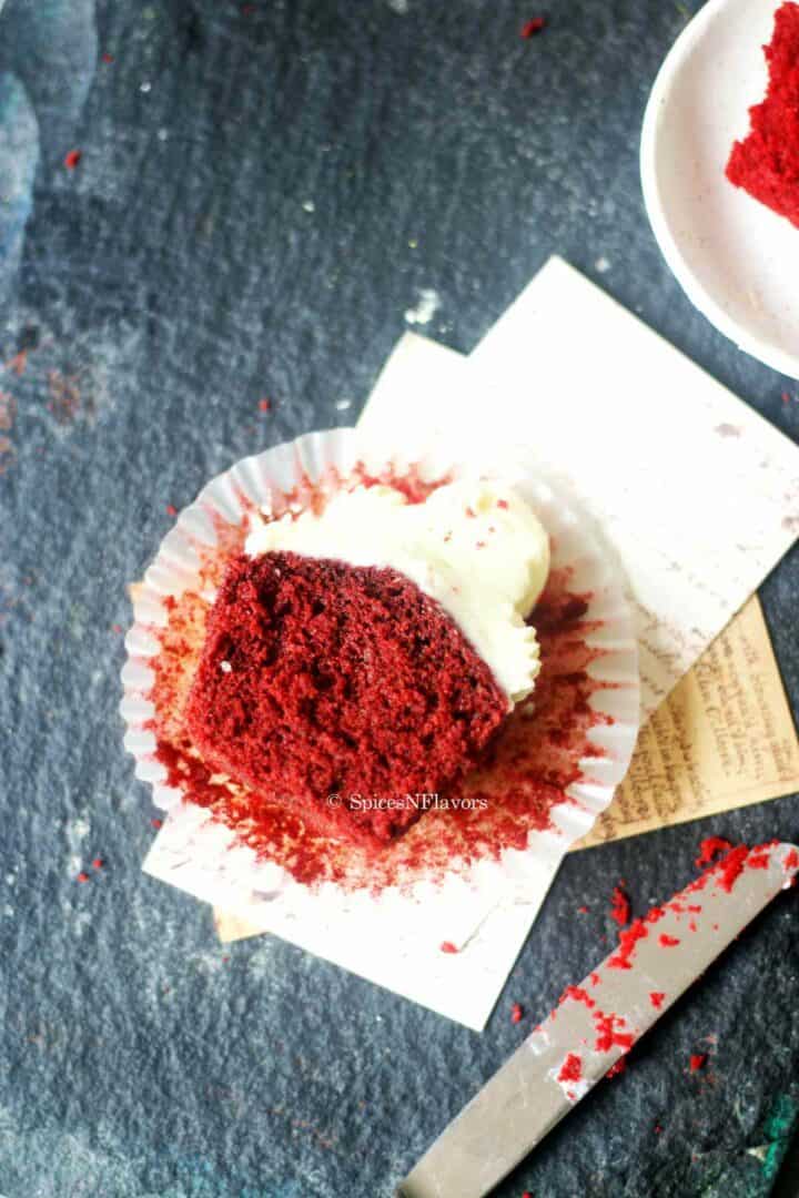 sliced image of red velvet cupcake that is reddish brown in colour