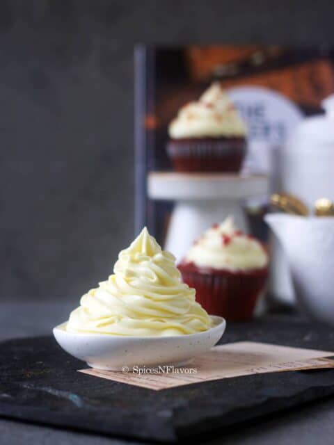 beautiful swirls of the easy vanilla frosting piped on a small bowl