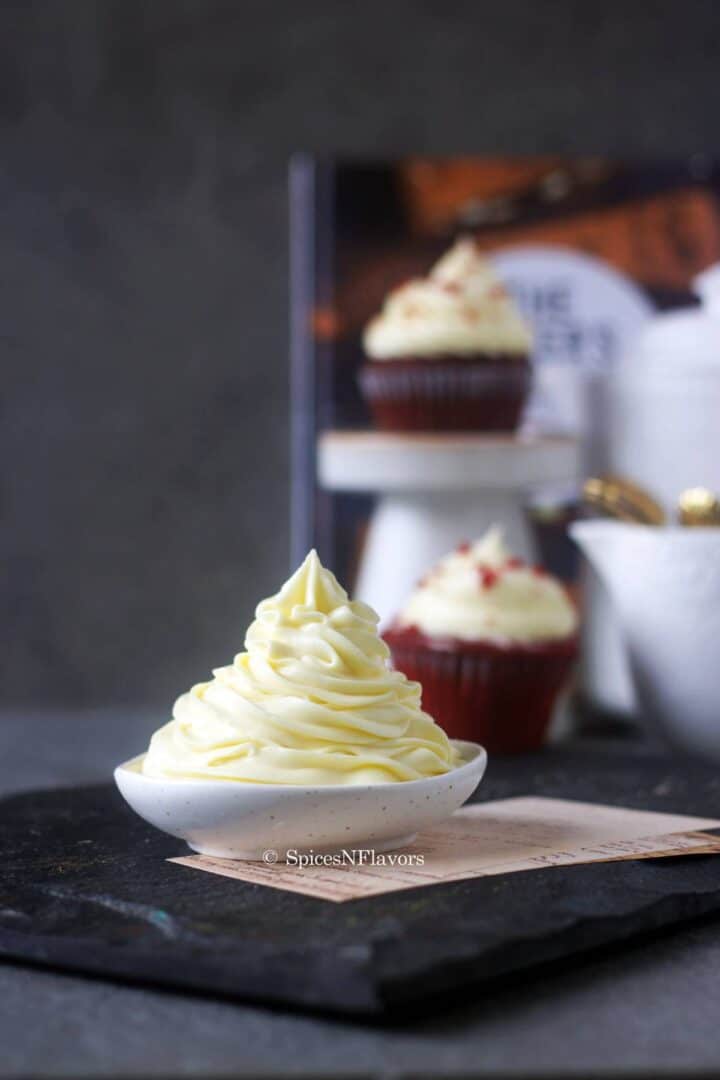 beautiful swirls of the easy vanilla frosting piped on a small bowl