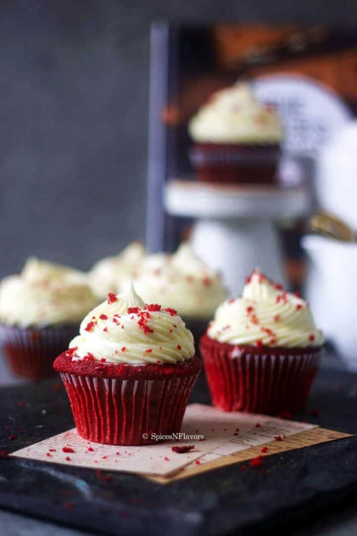 easy vanilla frosting piped on red velvet cupcakes showcasing the stability 