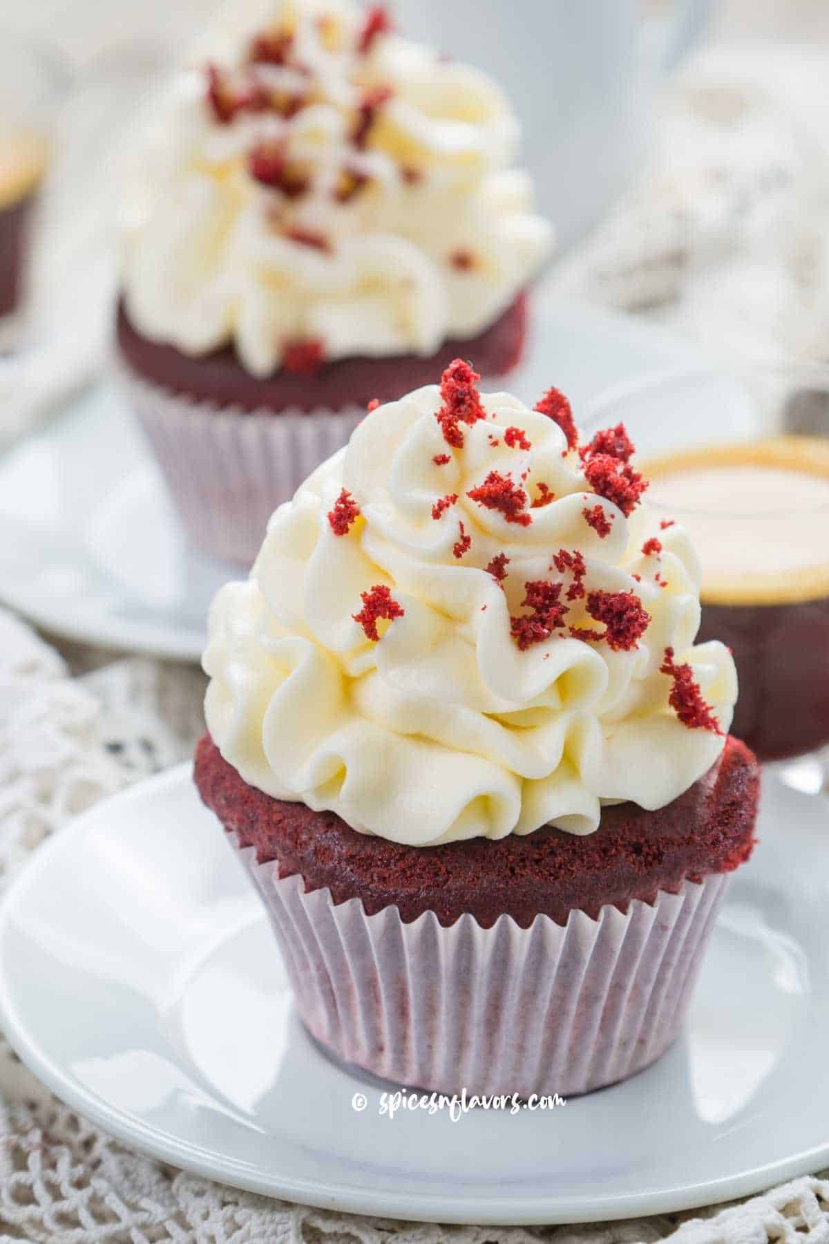 eggless red velvet cupcakes frosted with cream cheese frosting