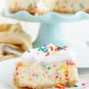 slice of funfetti cheesecake placed on white plate