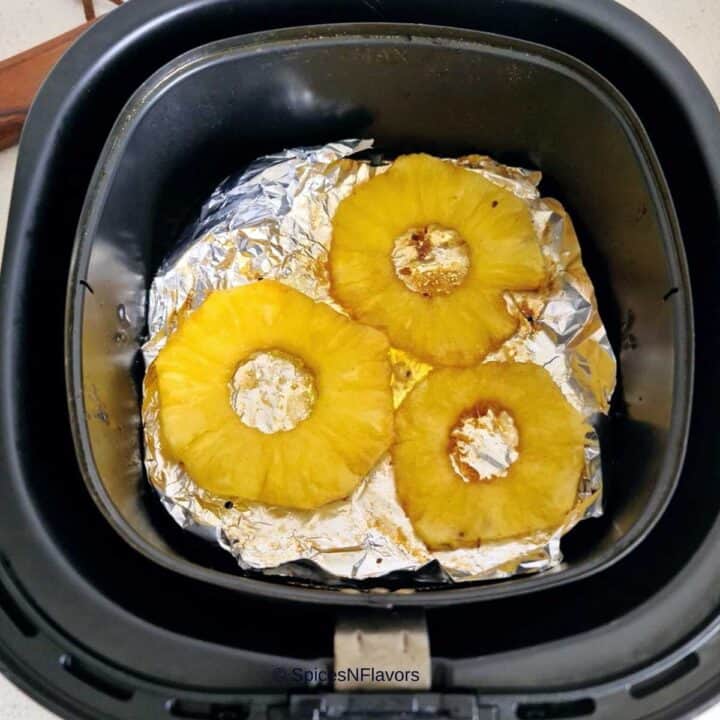 place the smeared pineapple rings in your air fryer basket