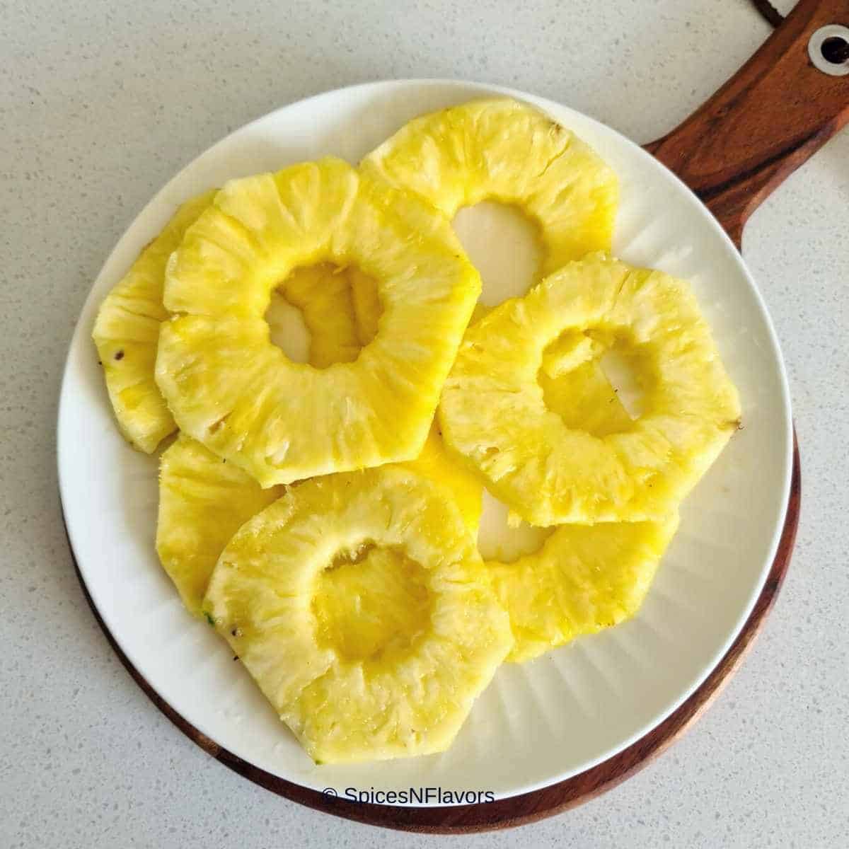 pineapple rings placed on a white plate