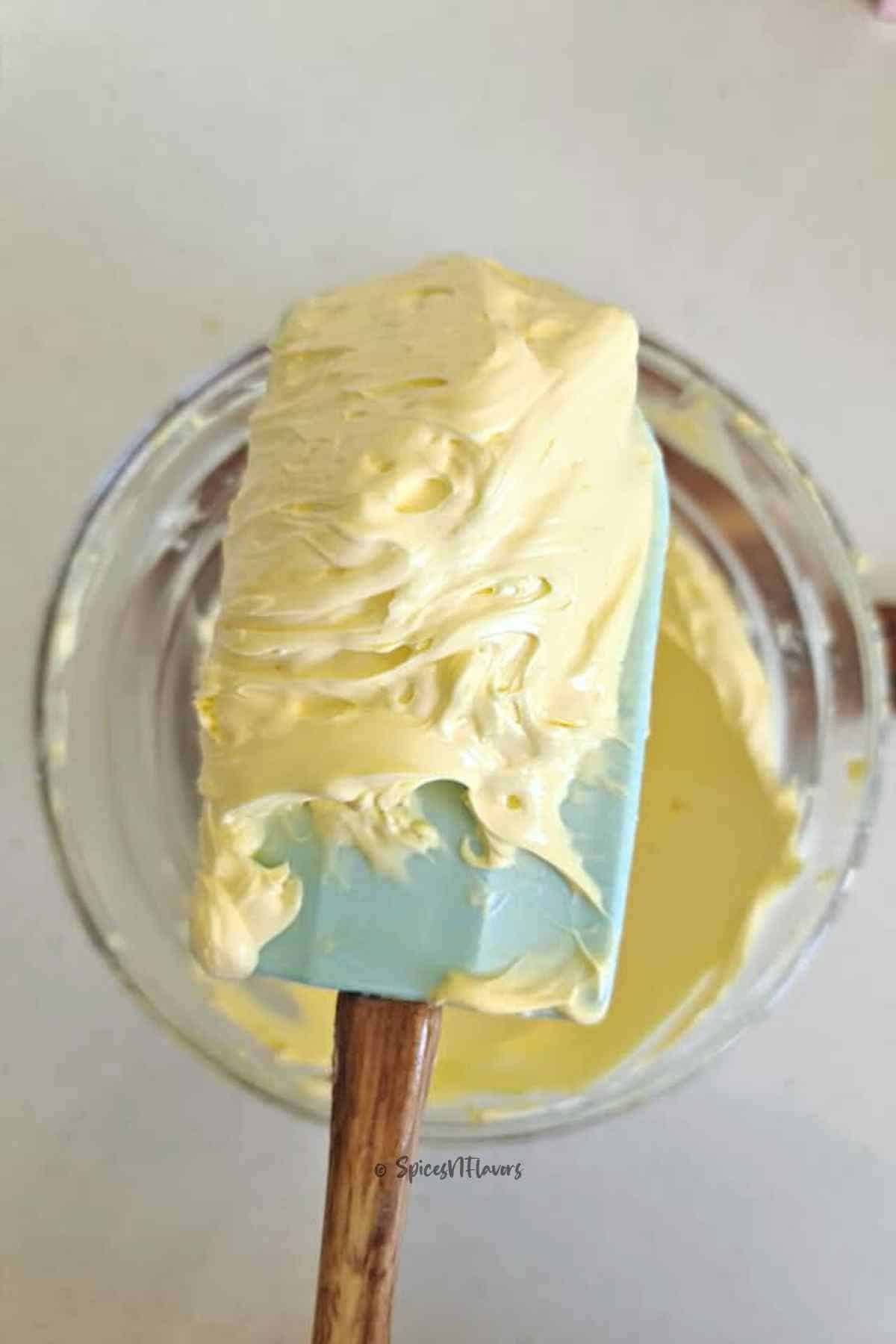 whipped butter scooped out using a spatula