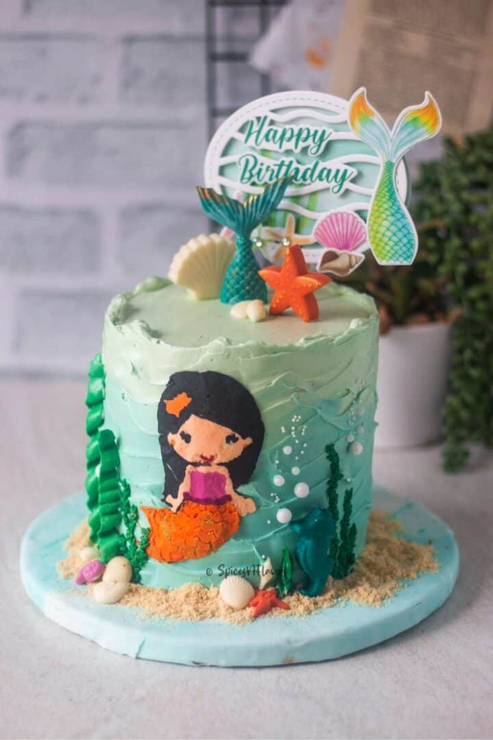 4 layer birthday cake decorated in mermaid theme