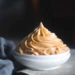 cropped image of the frosting piped on white bowl to fit the recipe card image