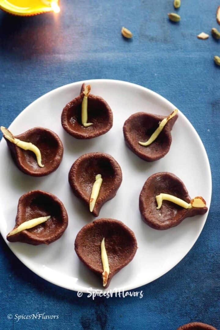 edible chocolate diyas placed on white plate