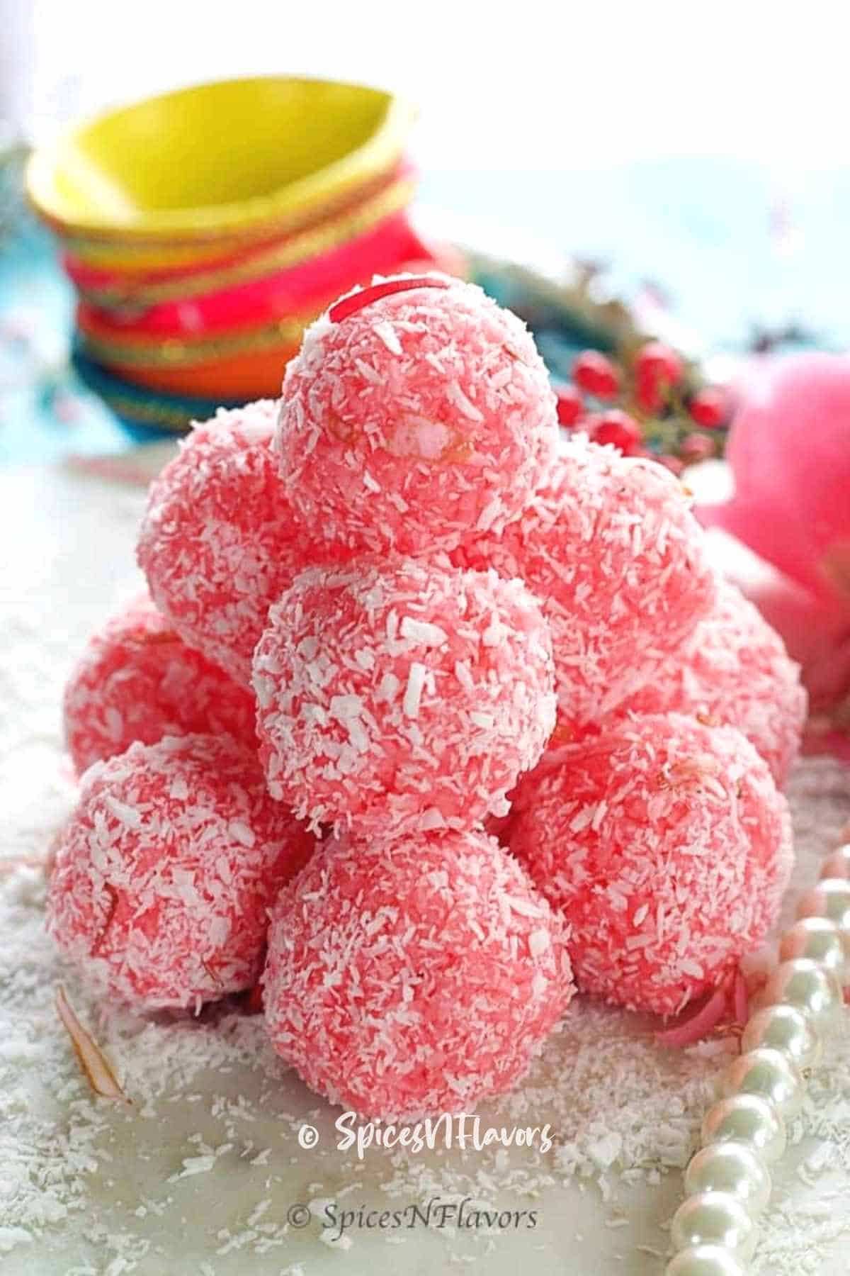 rose ladoo stacked like a pyramid on marble slab
