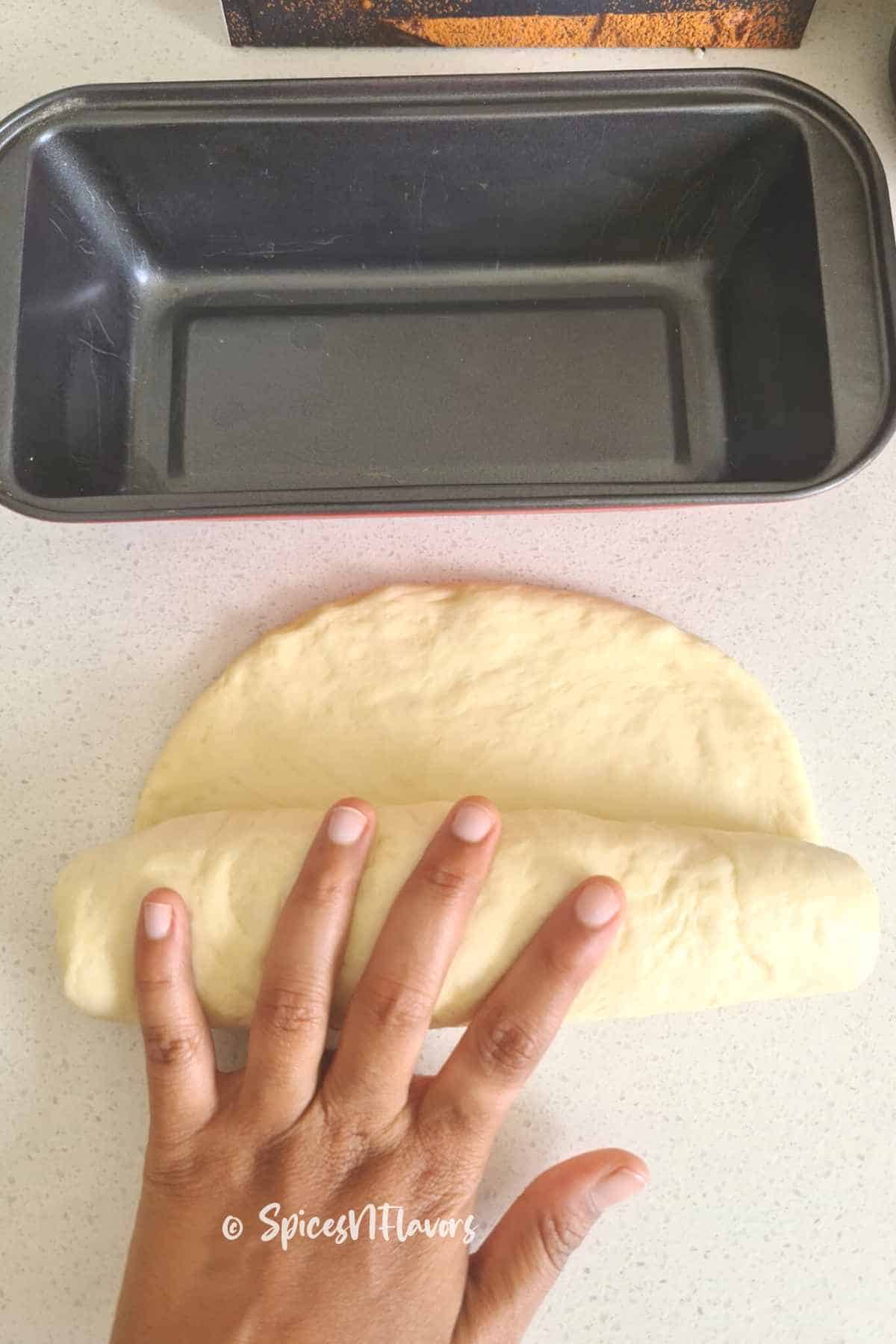 shape the dough into a log shape by rolling