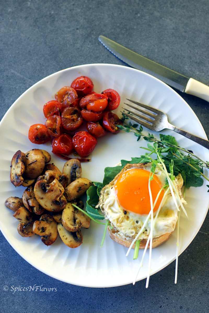 ciabatta rolls served with eggs, mushrooms and tomatoes