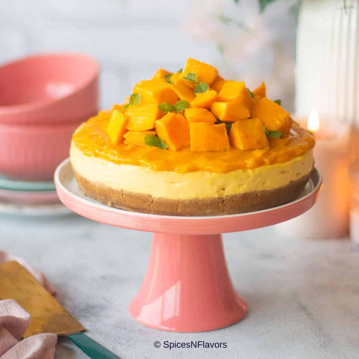 cropped up image of baked mango cheesecake to fit recipe card