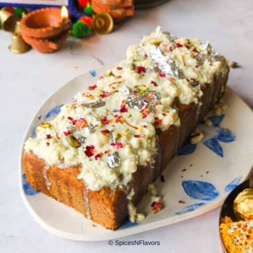 cropped up image of gulab jamun mix cake with rabdi on top to fit the recipe card image