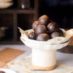 cropped image of coffee truffles placed on a plate to fit the recipe card image size