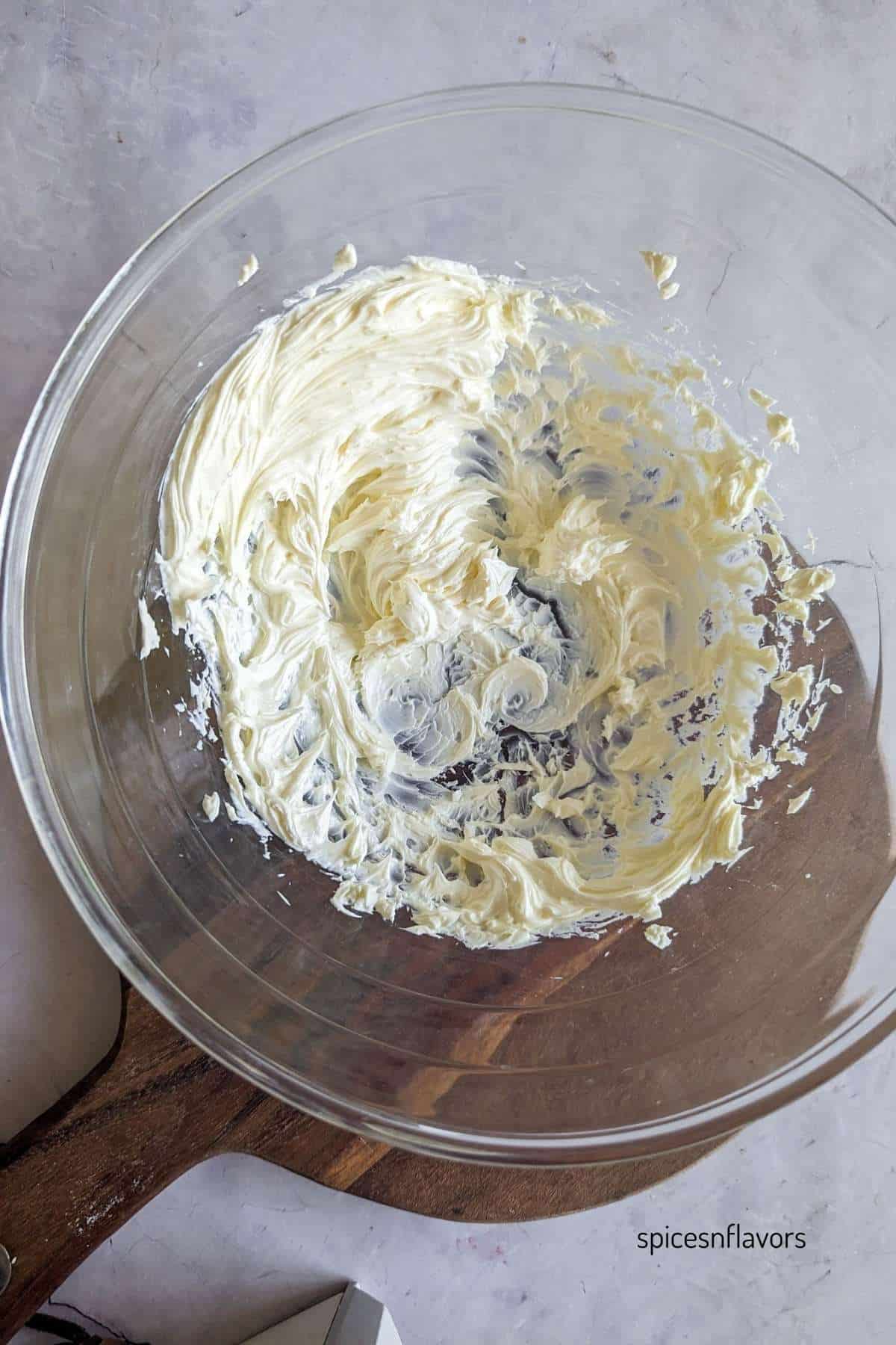 Beat cream cheese until creamy