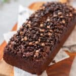 close up image of eggless double chocolate banana bread on wooden board to fit the recipe card