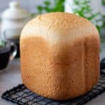 close up image of honey wheat bread made in bread machine for recipe card