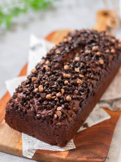 eggless double chocolate banana bread placed on a wooden serving board